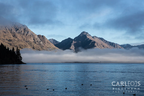 Early Morning Fog Covering The Peaks Of Lake Wakatipu Queenstown