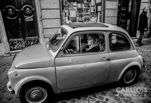 Woman in her car Rome, Italy